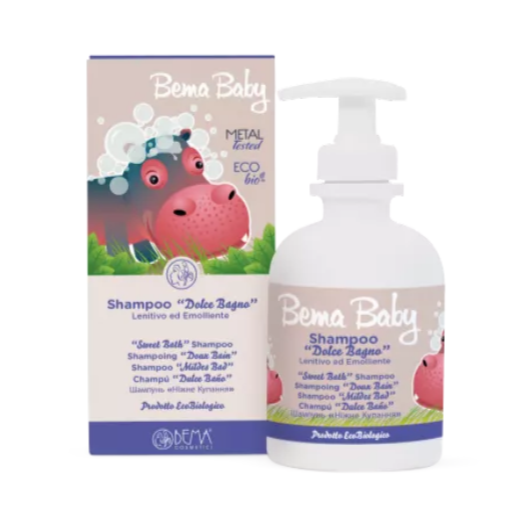 A bottle of Bema Baby Sweet Bath Shampoo, featuring a playful hippopotamus on the packaging. The product is labeled "Shampoo Dolce Bagno" and is described as a gentle and emollient shampoo for babies. The bottle is white with a pump dispenser, and the box packaging also features the same branding and multilingual product description. The product is labeled as "Metal Tested" and "Eco Bio."