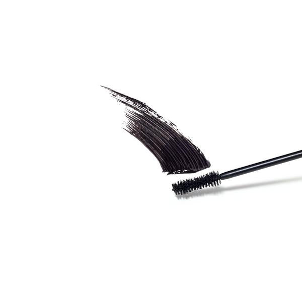 A curved line of black mascara with a smooth, textured finish, accompanied by the mascara brush. The product is designed to lengthen and volumize eyelashes for a bold look.
