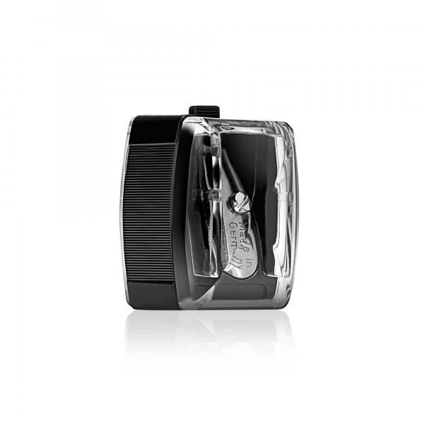 A close-up image of a black pencil sharpener with a transparent casing, labeled "Made in Germany." It is designed for sharpening pencils, showcasing its precise and compact design.