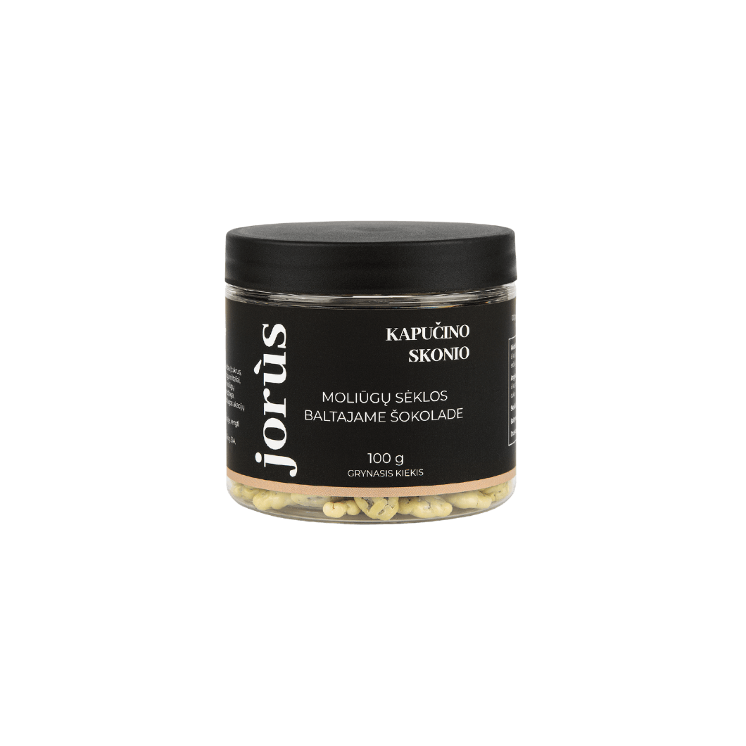 A jar of Jorus Cappuccino flavor snack, featuring a black label with the product name "Kapučino Skonio" and "Moliūgų Sėklos Baltajame Šokolade" written in white text. The jar contains white chocolate-covered pumpkin seeds with a cappuccino flavor. The label also includes a net weight of 100g.
