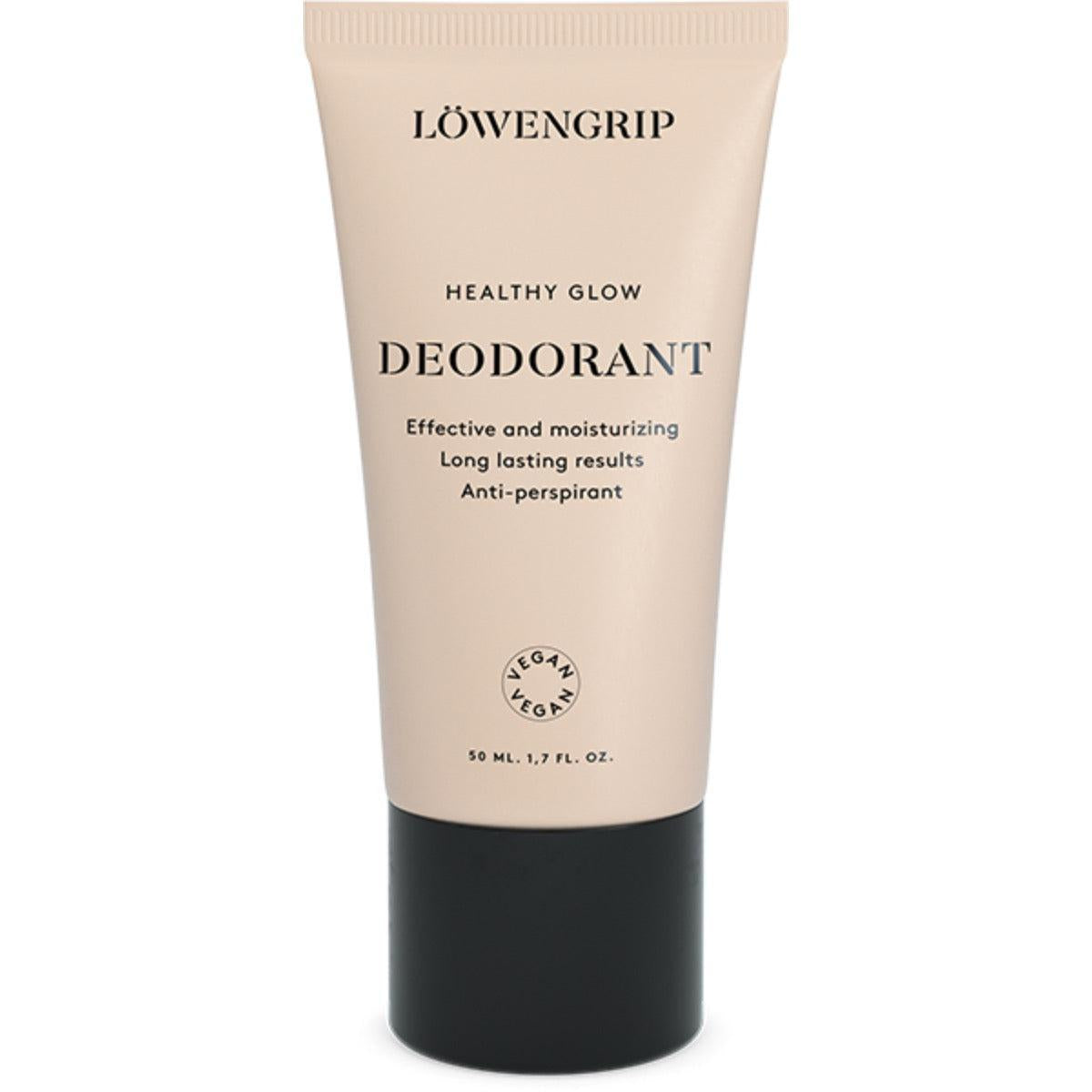 A tube of Löwengrip Healthy Glow deodorant in a light peach-colored packaging. This product promises effective and moisturizing results with long-lasting protection and anti-perspirant properties. It is labeled as vegan and comes in a 50 ml (1.7 fl. oz.) size.