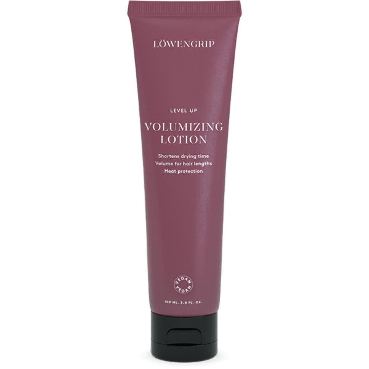 Level Up Volumizing Lotion
A maroon-colored tube labeled "Level Up Volumizing Lotion," featuring text that highlights its benefits: it shortens drying time, adds volume to hair lengths, and provides heat protection. The product is vegan, with a net volume of 100 mL.