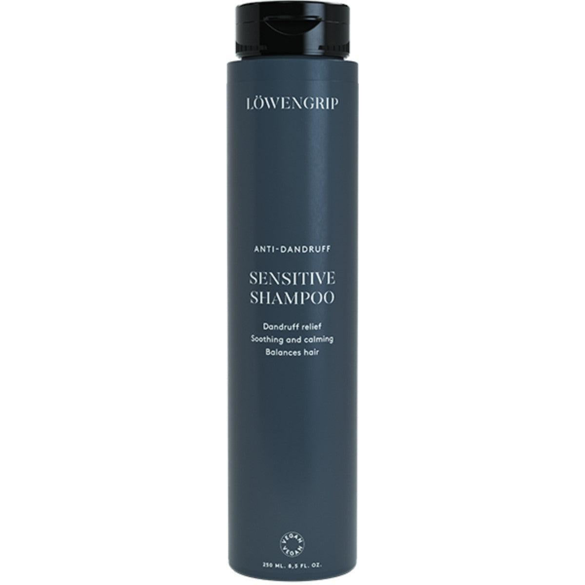 Sensitive Shampoo  
A bottle of Löwengrip Anti-Dandruff Sensitive Shampoo in a dark blue container. The product provides dandruff relief and soothes and calms the scalp while balancing the hair. It is marketed as being vegan and comes in a 250 ml size.