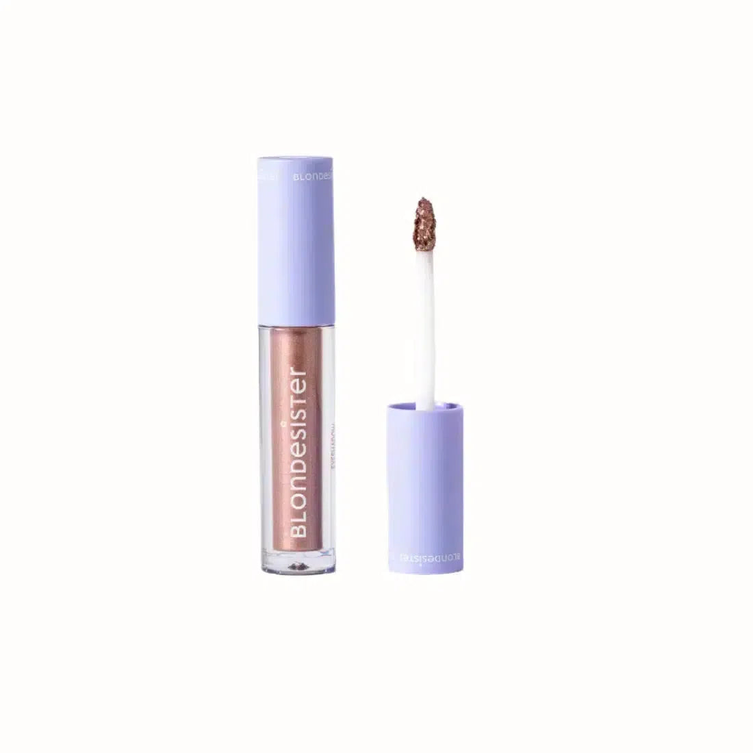 
A sleek tube of Blondesister liquid eyeshadow with a shimmering rose gold finish. The product comes with an applicator brush for easy and precise application. The packaging is minimalistic and stylish, featuring a soft lavender cap with the Blondesister logo. This eyeshadow delivers a bold metallic effect that’s ideal for enhancing any eye makeup look.