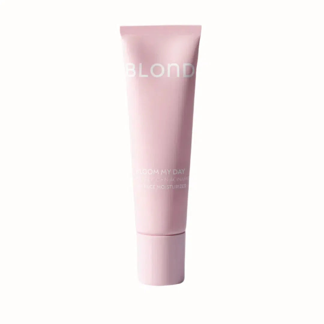 

A pink tube of Blond's Bloom My Day 24H Face Moisturizer. The label reads "BLOOM MY DAY" in large white font, with the subtitle "Probiotic + Niacinamide 24H Face Moisturizer" below. The design is sleek and minimalist, with the product promising hydration and skin benefits from probiotics and niacinamide. The packaging is modern, designed for daily use.