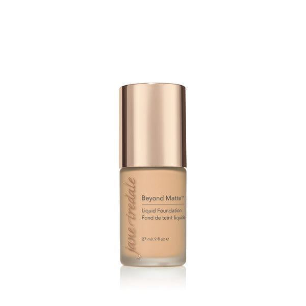 A bottle of Jane Iredale Beyond Matte Liquid Foundation with a soft beige tone, designed for a flawless, matte finish. The foundation provides long-lasting coverage and a smooth appearance, perfect for controlling oil and creating a matte, even complexion. The elegant packaging with a rose-gold cap offers a luxurious touch to your beauty essentials.






